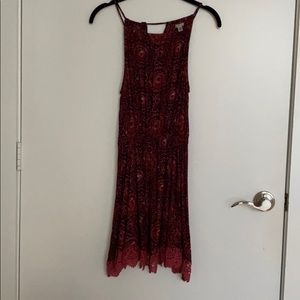 Pink and red patterned dress, cinched in middle